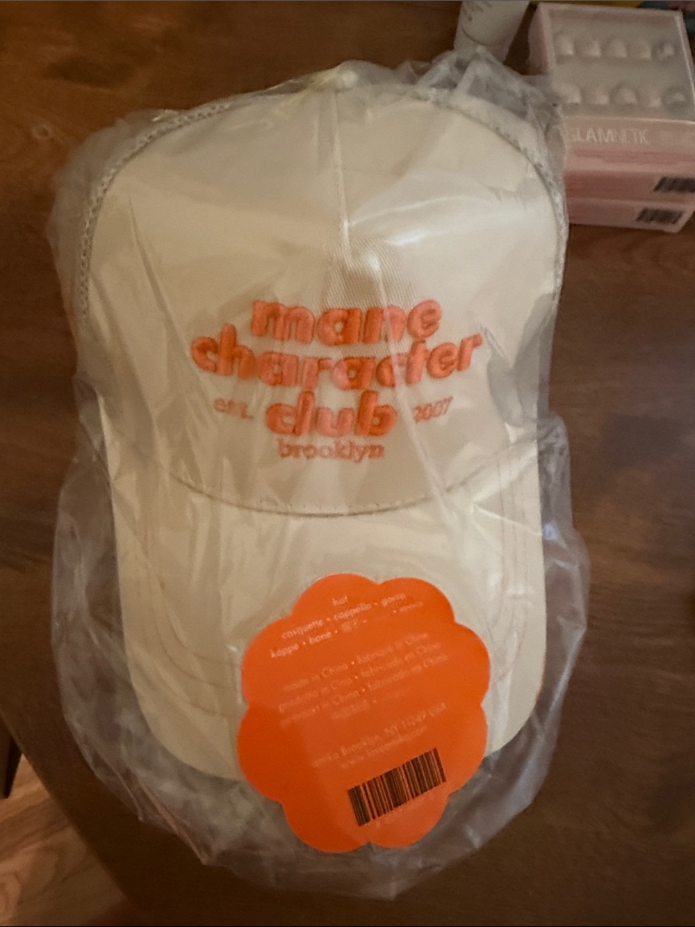 amika Cream Baseball Cap with Orange Embroidered Logo
